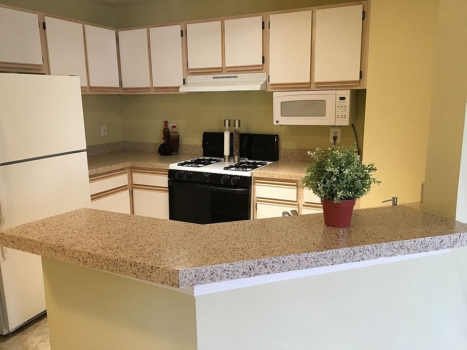 Open kitchen with a breakfast bar and built in microwave