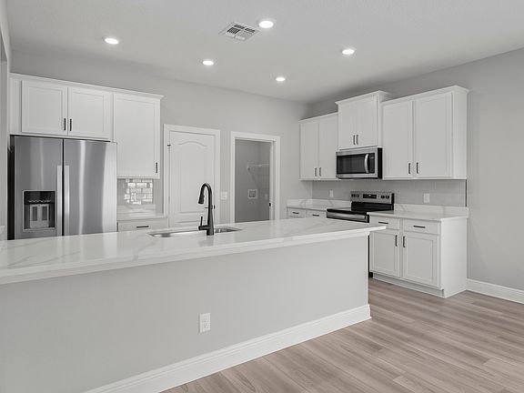 The spacious kitchen is perfect for preparing your family s favorite meals and treats.
