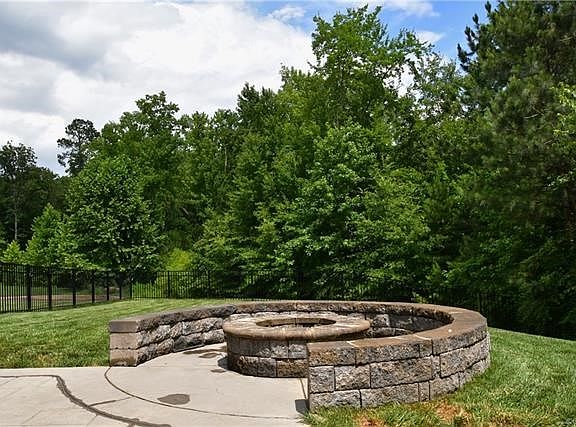 Stamped concrete patio and stone firepit. Think Fall, Think roasted marshmellows