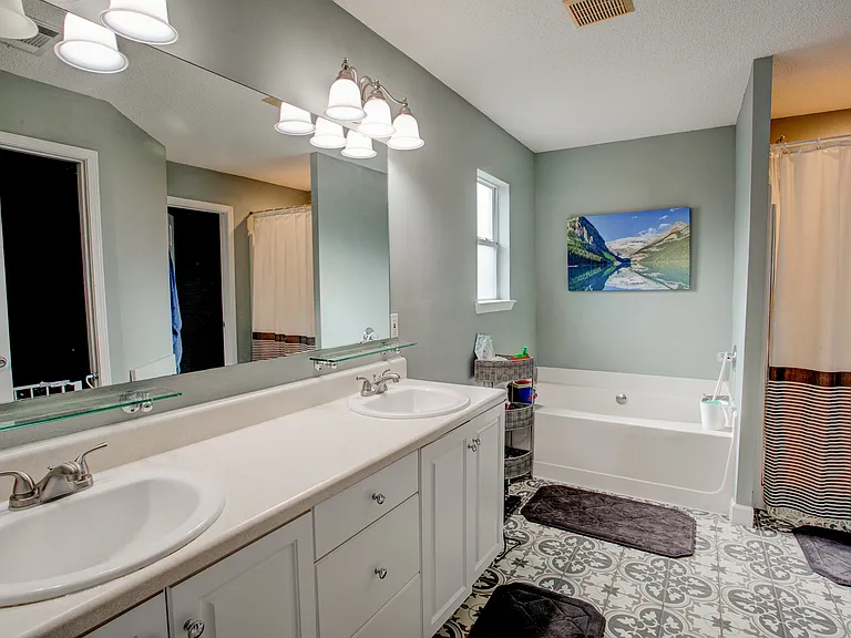Master Bathroom with a large walk-in closet