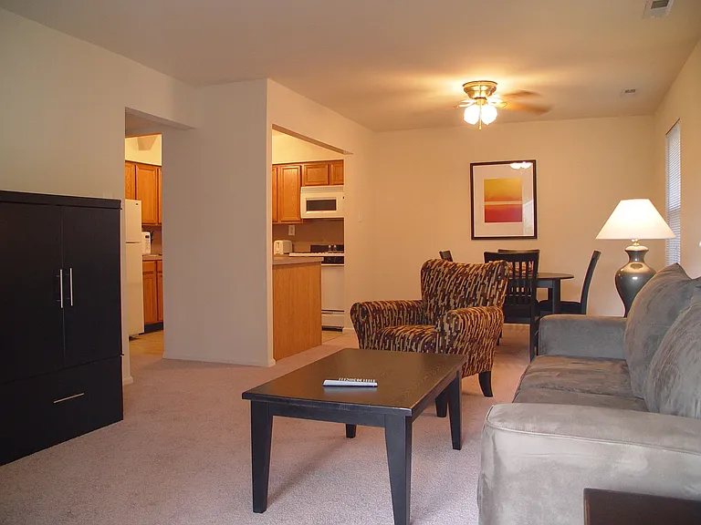 Open concept floor plan with view from living area looking into dining area and kitchen