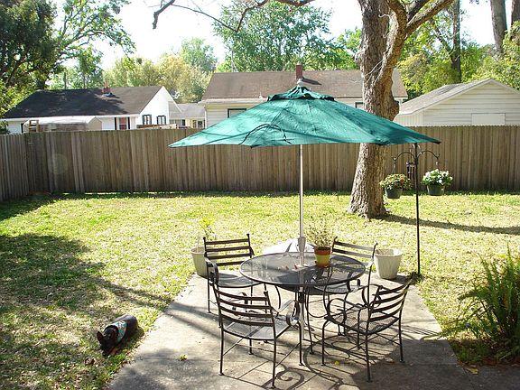 Spacious backyard with privacy fence