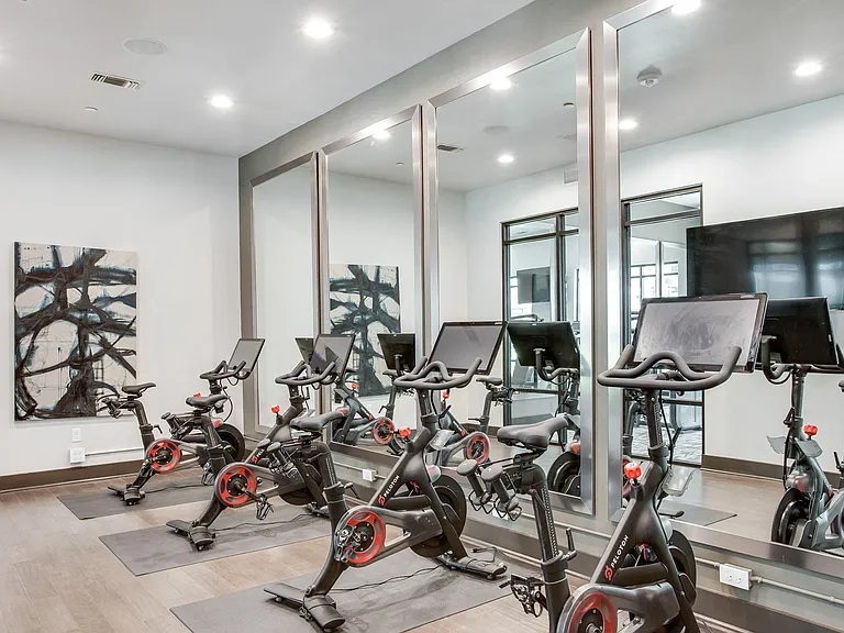 Indoor cycling featuring Peloton bikes with on-demand fitness classes