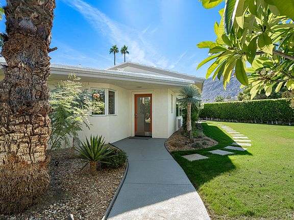 Front yard walkway to primary house entrance.