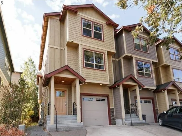 Front of home, garage plus 2 tandem driveway spots