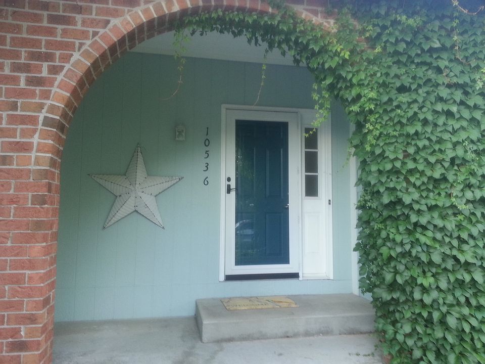 Ivy covered brick arch entry