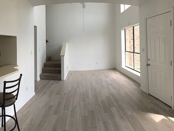 Living/dining room with kitchen bar seating