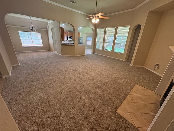 Living room over looking dining room and kitchen