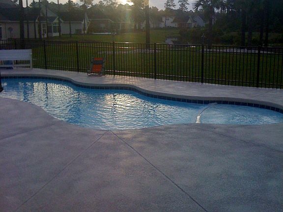 backyard pool and lake view