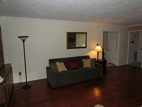 Spacious den with beautiful floors.