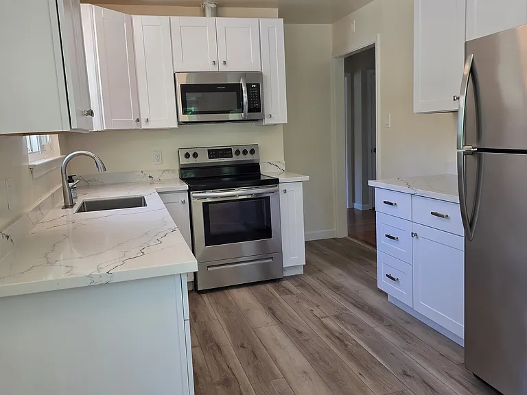 All new cabinets, stainless steel appliances and new quartz countertops.