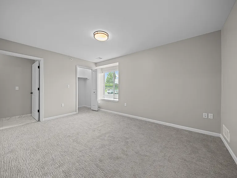 Bedroom with Ample storage space at The Reserve at Prentiss Pointe Apartments in Harrison Township, MI