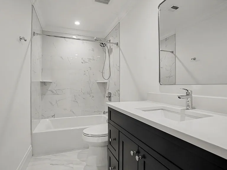 A Beautifully Finished Full Bathroom Provides Added Convenience and Completes the Third_Level Layout.