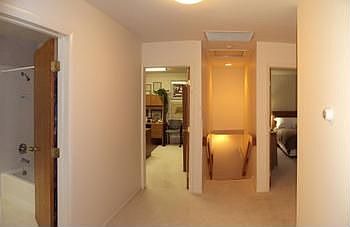 Wide hall on the second floor. The home has central air w2 auxiliary room air conditioners. It also 