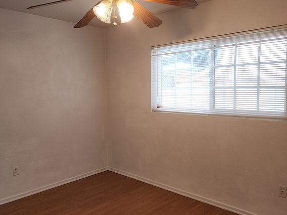 Both bedrooms have ceiling fans and large windows for lots of light.