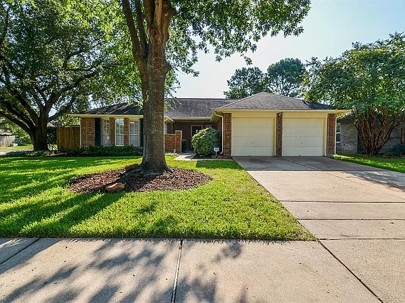 Mature landscaping and double wide extra long driveway provides excellent curb appeal.