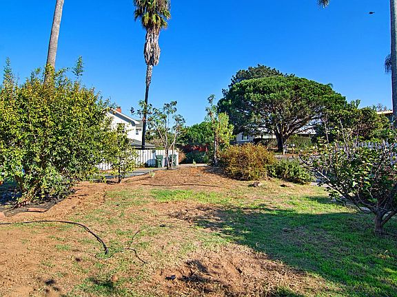Front Yard with automatic drip system, fruit trees, and icon