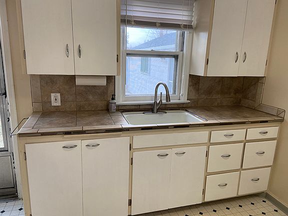 Tile countertop and window to back patio