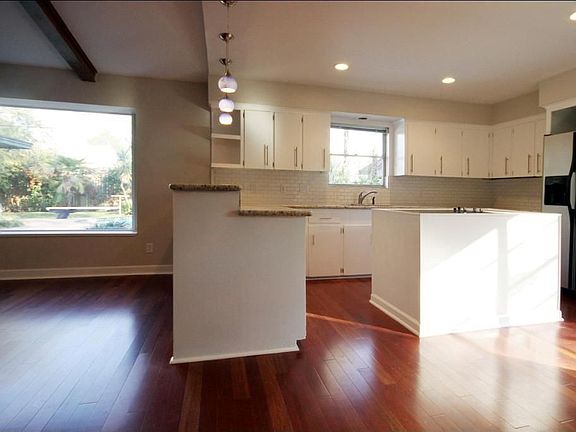 The kitchen has lots of counter space and a center island.