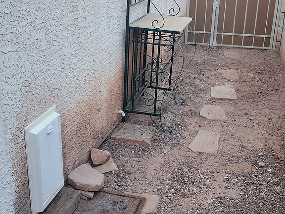 Long narrow patio with doggy door for the convenience of your furry friend's needs.