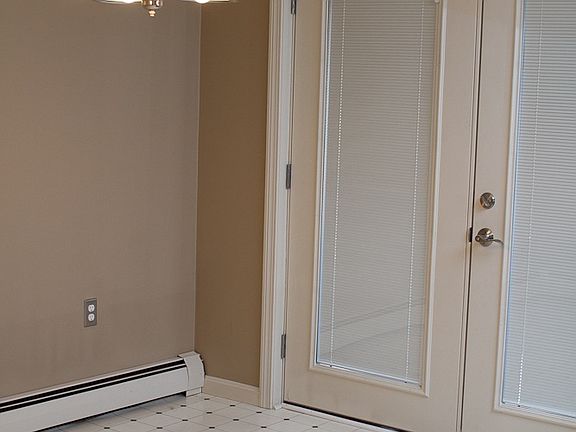 Dining room w French door to 3 season room