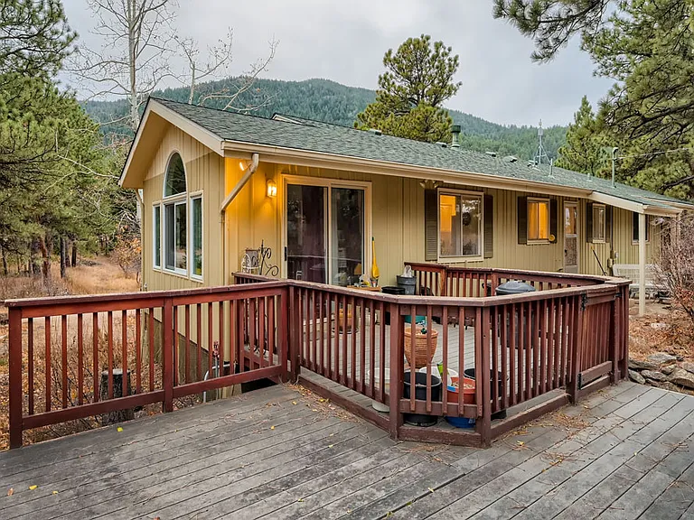 Upper level enclosed 3rd patio space. Comes with picnic table and planters