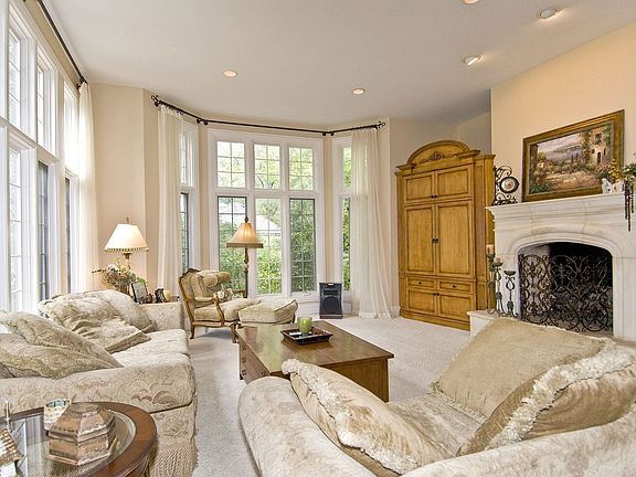 Family room is open to kitchen, eat-in area, patio.