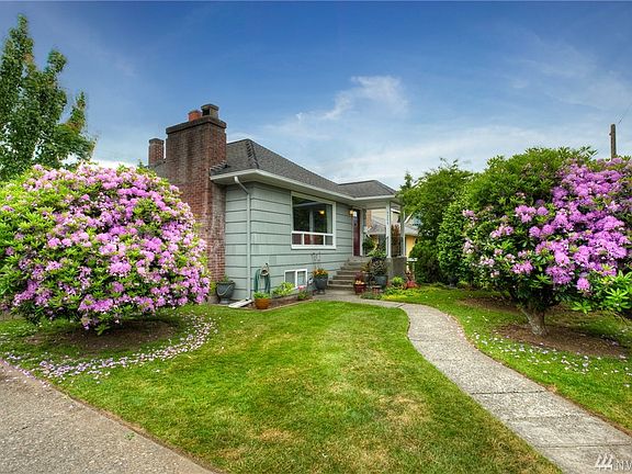 Perfectly positioned on a corner lot, this Seattle fringe home upgrades your lifestyle and everyday convenience.