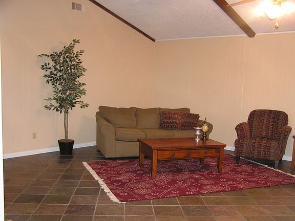 Family Room with vaulted ceiling and wood beams