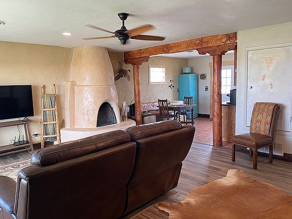 kiva and hand carved beam