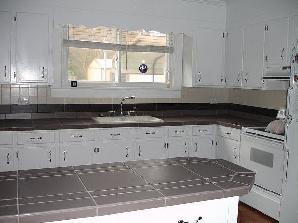 New countertops and backsplash in large kitchen