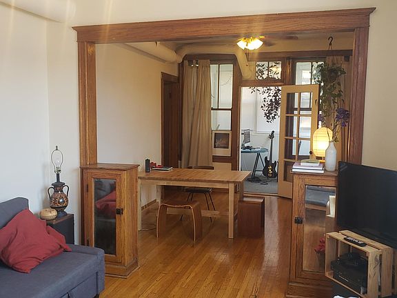 living/dining with sunroom in backround, rooms get tons of light