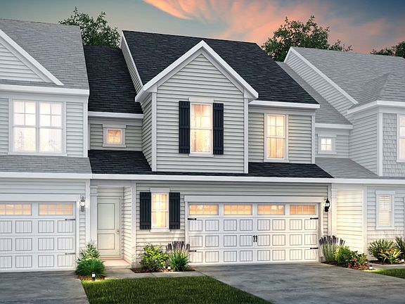 Palomino Exterior 4 features siding, covered front door and 2-car front load garage