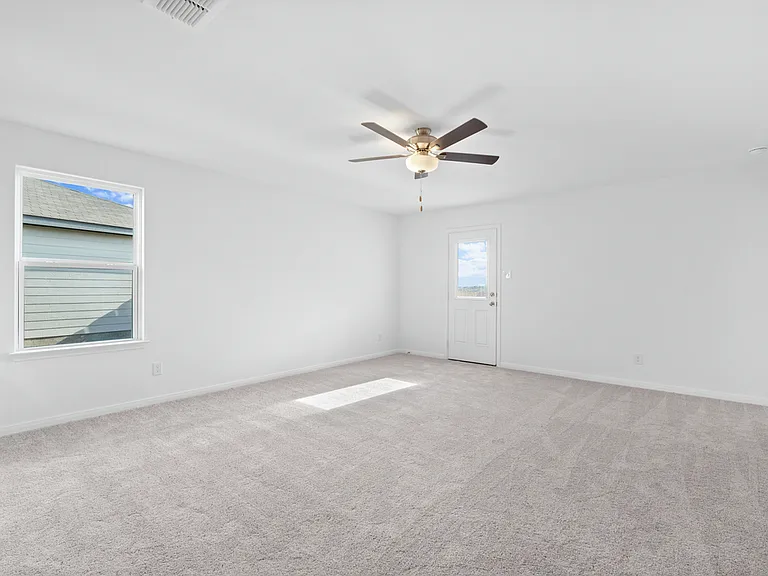 Cozy family room with a door to the backyard.