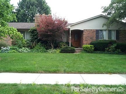 Street View 3011 Blossom
						:
						Lots of perennials with brick paver sidewalk and porch.