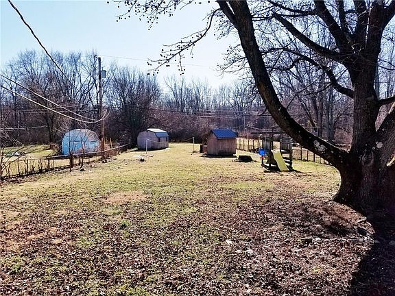 Bright airy living room looking in the kitchen from the front door...