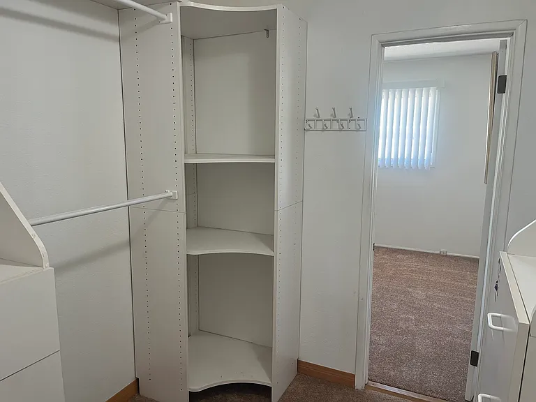 Bedroom 1 walk in closet. Connects to Bedroom 2