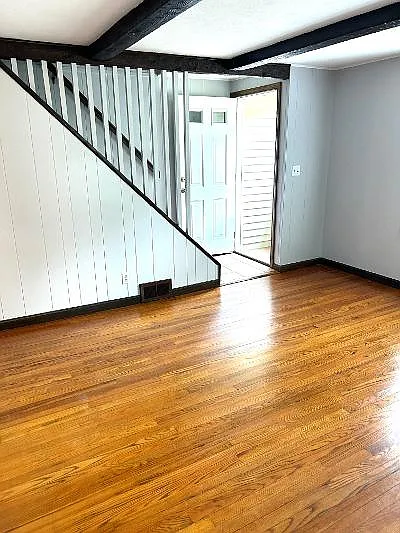 Front entrance with a breezeway, which leads to Livingroom or stairway to second level.