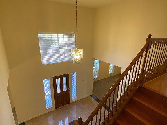04. Two-story foyer, marble and tile floor throughout downstairs, hardwood on staircases and entire upstairs.