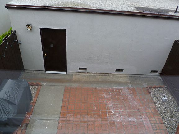 Patio with access to garage where laundry hook up is availab