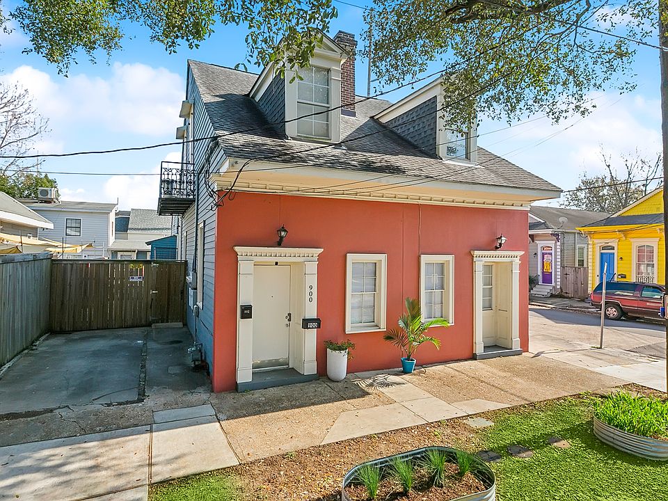 Front view w/ driveway which would be yours! At back of driveway is fence and gate to courtyard