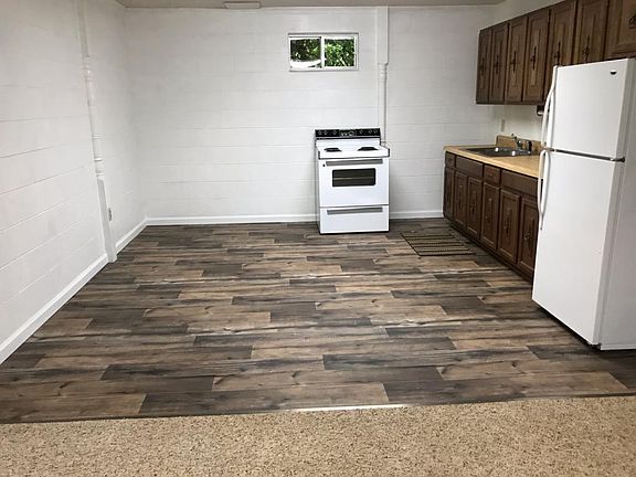 Plenty of room in kitchen for an island, table, and storage/china cabinet.