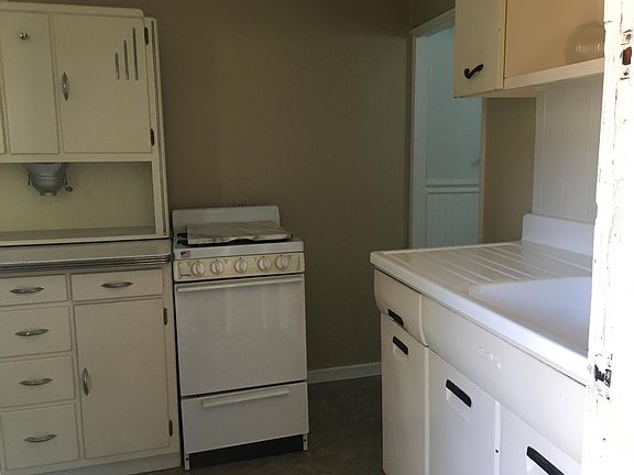 Vintage kitchen cabinets with great storage.
