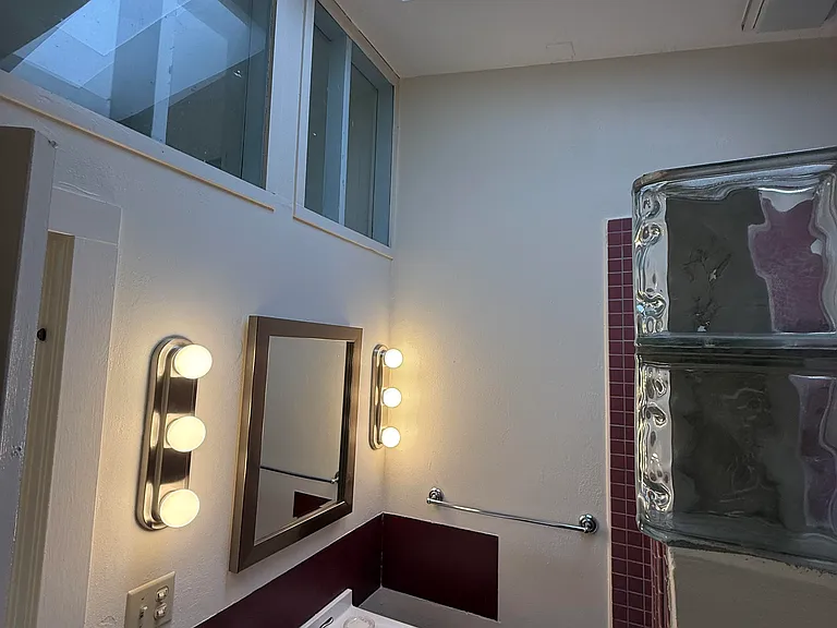 Sink showing windows and skylight