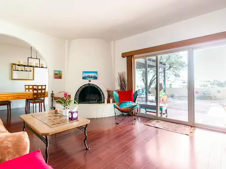 Working beehive fireplace, and arches that soften the decor