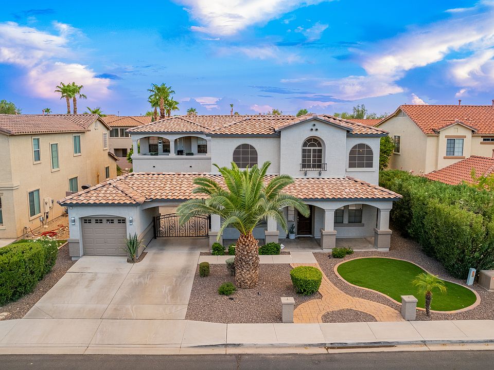Front of the home. Small garage is not available in rental but a two car garage is, you drive through arch to park in.