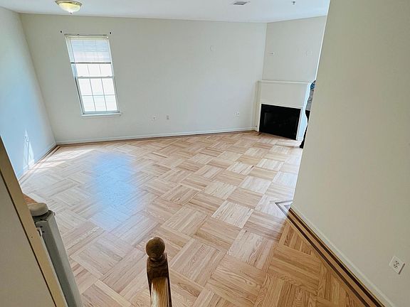 View from Hallway Landing looking down into the Open Floor Living Room