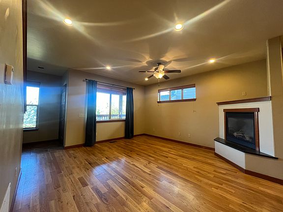 Main Level Living Room with gas fireplace and hardwood floors