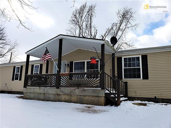 Front of the home with covered patio.