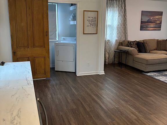 Laundry room behind sliding barn door. Washer and Dryer included!